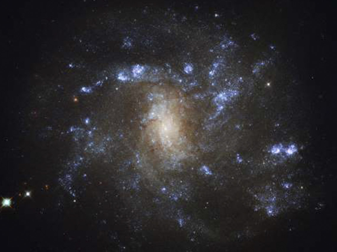 A picture of the galaxy ngc 1 3 0 7 taken by hubble.