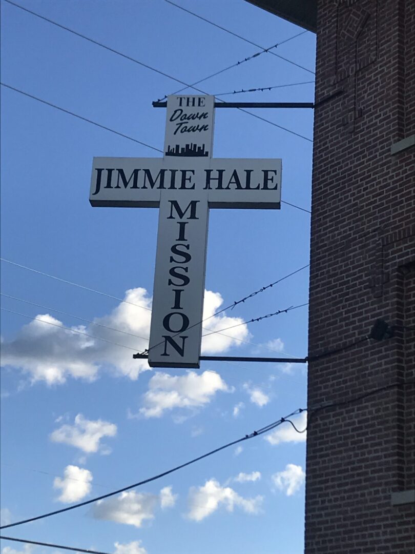 A cross with the name of jimmie hale miston on it.