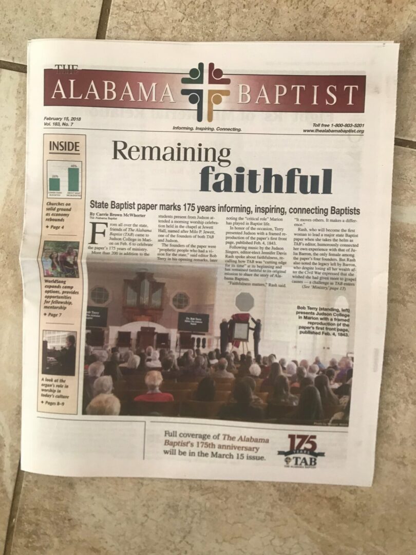 A newspaper with the front page of an article about a church.