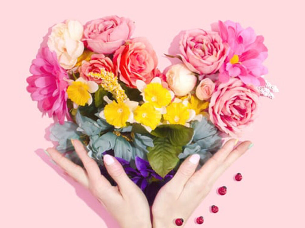 A person holding flowers in their hands