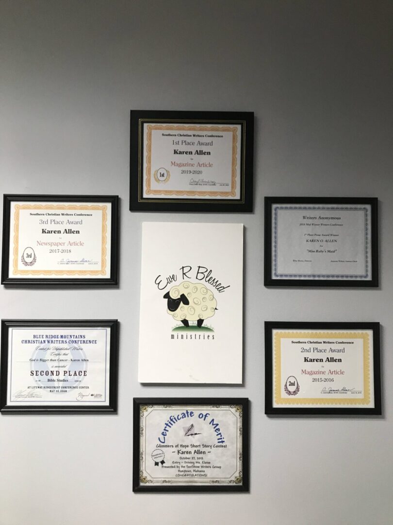 A wall with several certificates hanging on it.