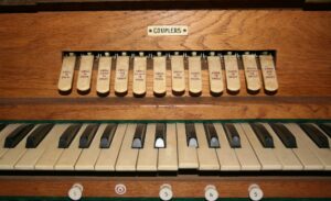 A close up of two keyboards on the organ