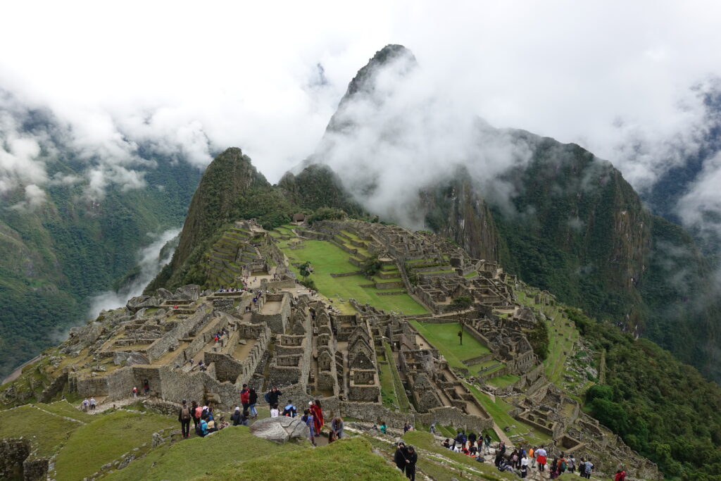 A group of people standing on top of a mountain.