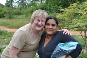 Two women are posing for a picture together.