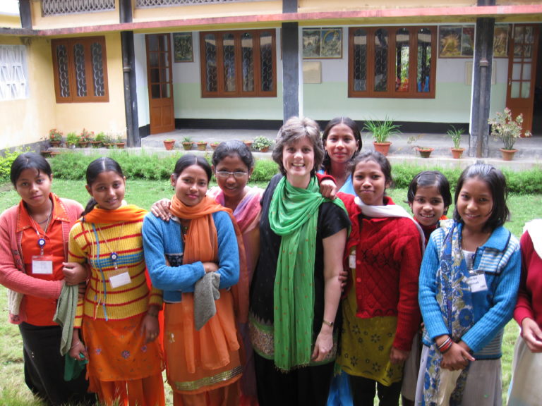 A group of women standing next to each other.