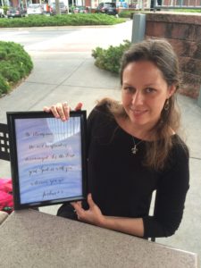 A woman holding up an ipad with music notes on it.