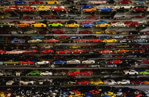 A large collection of toy cars in a store.