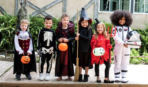 A group of children dressed up in costumes.