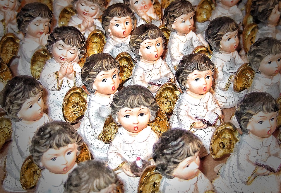 A group of small angels sitting in rows.