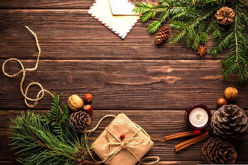 A wooden table with some christmas decorations on it